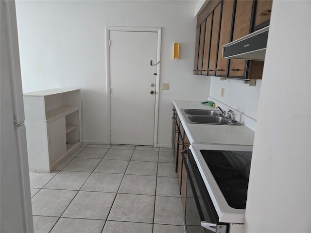 2308 18th St E, Bradenton, FL 34208 - kitchen with white electric range oven, light countertops, light tile patterned flooring, open shelves, and dark brown cabinetry