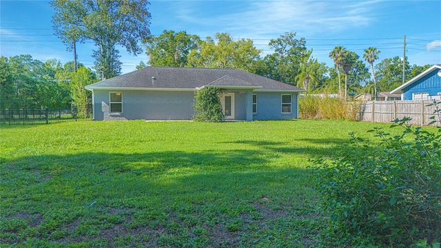 4911 NE 7th St, Ocala, FL 34470 - rear view of house with a fenced backyard and stucco siding