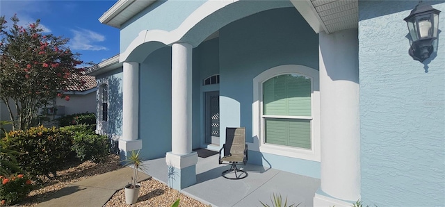 1884 Coconut Palm Cir, North Port, FL 34288 - property entrance featuring stucco siding