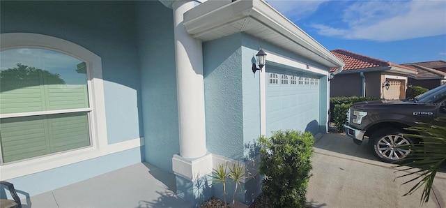 1884 Coconut Palm Cir, North Port, FL 34288 - view of home's exterior with stucco siding and a garage