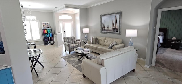1884 Coconut Palm Cir, North Port, FL 34288 - living room with light tile patterned flooring, ornamental molding, and a chandelier