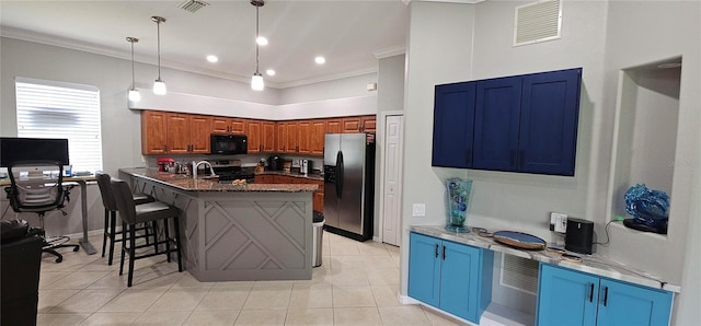 1884 Coconut Palm Cir, North Port, FL 34288 - kitchen featuring appliances with stainless steel finishes, a breakfast bar area, crown molding, light tile patterned floors, and brown cabinets
