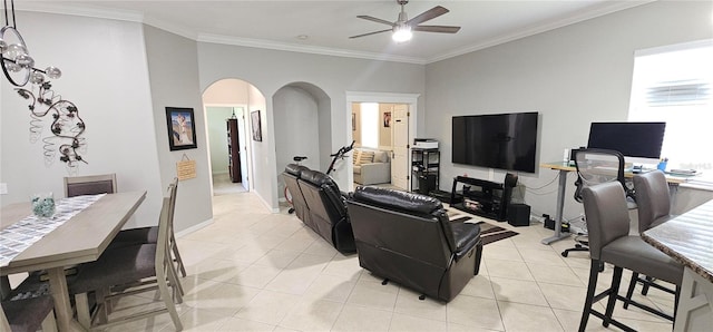 1884 Coconut Palm Cir, North Port, FL 34288 - living room with arched walkways, ceiling fan, light tile patterned flooring, and ornamental molding