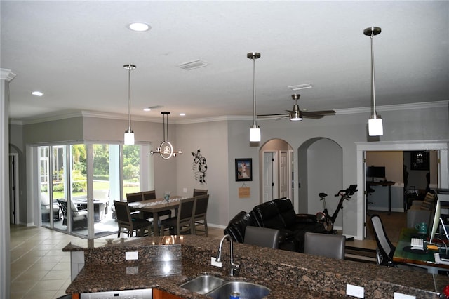 1884 Coconut Palm Cir, North Port, FL 34288 - kitchen with arched walkways, recessed lighting, ceiling fan, decorative light fixtures, and ornamental molding