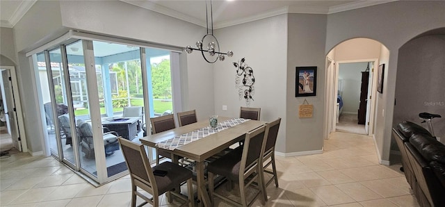 1884 Coconut Palm Cir, North Port, FL 34288 - dining room with arched walkways, light tile patterned floors, ornamental molding, and a chandelier
