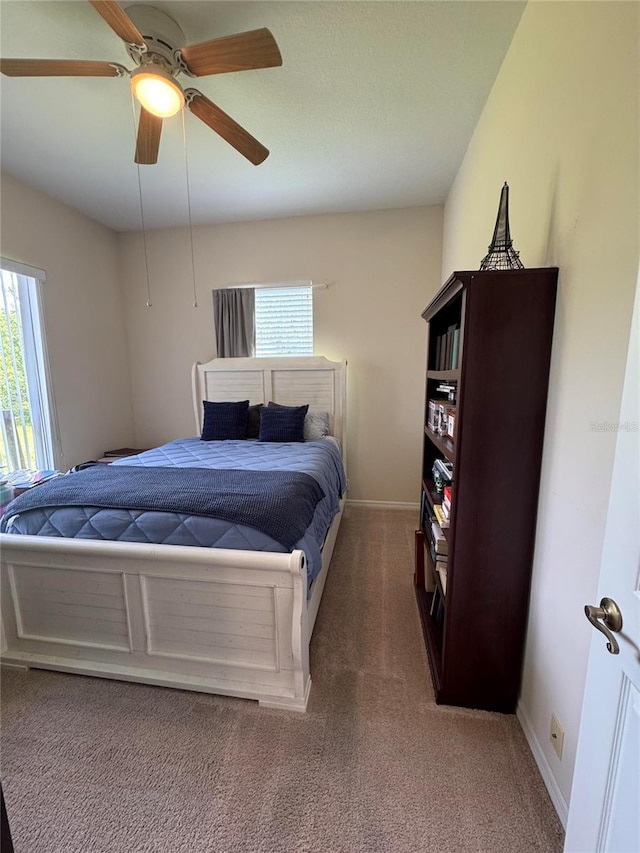 1884 Coconut Palm Cir, North Port, FL 34288 - bedroom featuring multiple windows, carpet floors, and a ceiling fan