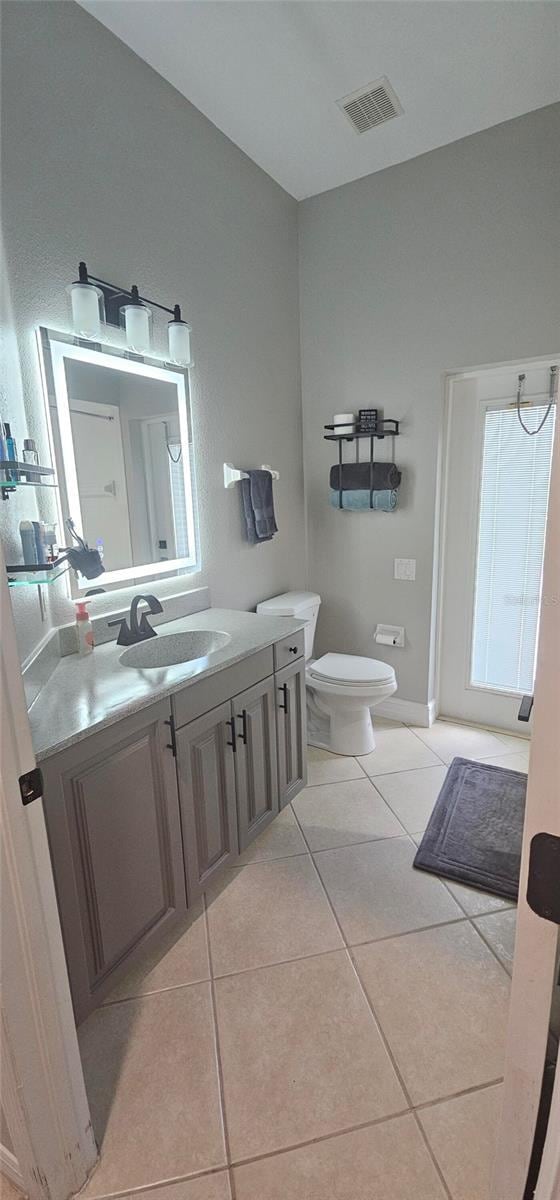 1884 Coconut Palm Cir, North Port, FL 34288 - bathroom with tile patterned flooring and vanity