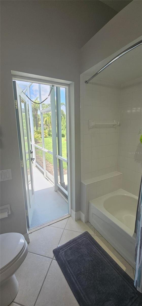 1884 Coconut Palm Cir, North Port, FL 34288 - bathroom featuring shower / tub combination and tile patterned floors