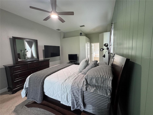 1884 Coconut Palm Cir, North Port, FL 34288 - bedroom featuring light colored carpet, a ceiling fan, lofted ceiling, and connected bathroom