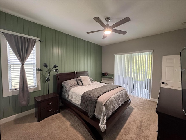 1884 Coconut Palm Cir, North Port, FL 34288 - bedroom featuring access to outside, light carpet, and ceiling fan