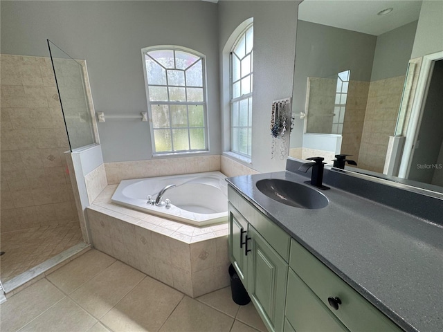 1884 Coconut Palm Cir, North Port, FL 34288 - bathroom with a bath, vanity, walk in shower, and tile patterned flooring