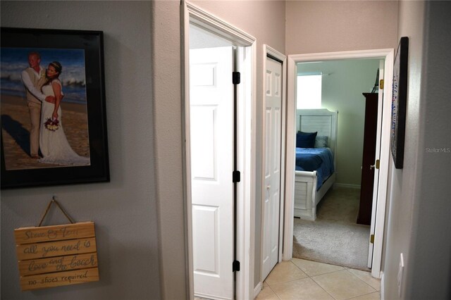 1884 Coconut Palm Cir, North Port, FL 34288 - corridor with light tile patterned floors