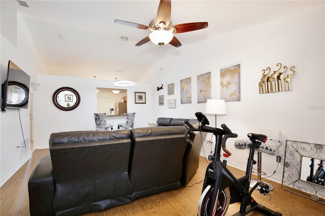 3415 Celena Cir, Saint Cloud, FL 34769 - living room featuring vaulted ceiling, a ceiling fan, and wood finished floors