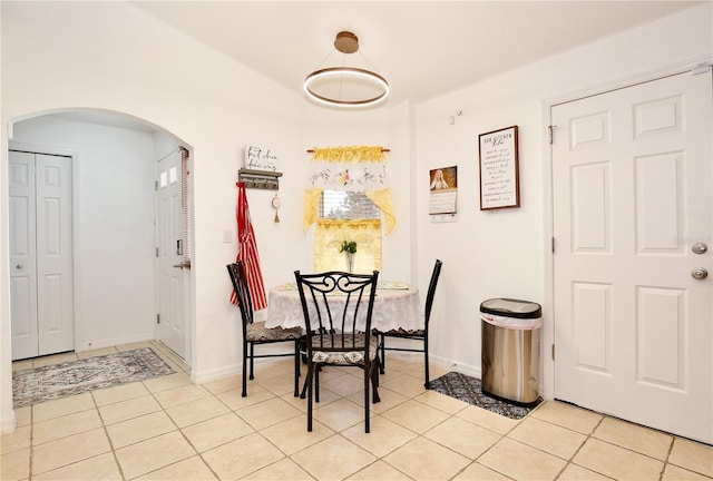 3415 Celena Cir, Saint Cloud, FL 34769 - dining room with arched walkways and light tile patterned floors