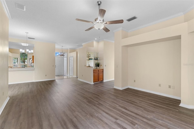 14558 Mandolin Dr, Orlando, FL 32837 - unfurnished living room with ornamental molding, dark wood-type flooring, a ceiling fan, and a chandelier