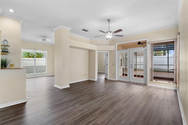 14558 Mandolin Dr, Orlando, FL 32837 - unfurnished living room with ceiling fan, plenty of natural light, crown molding, dark wood-style floors, and french doors