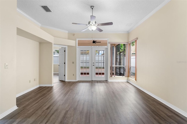 14558 Mandolin Dr, Orlando, FL 32837 - spare room with dark wood-style flooring, french doors, ceiling fan, a textured ceiling, and crown molding