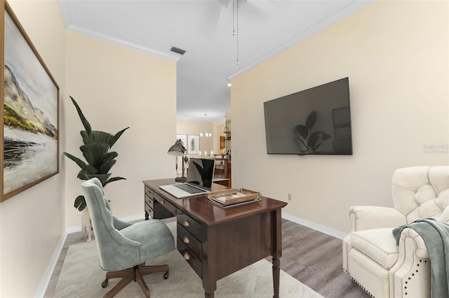 14558 Mandolin Dr, Orlando, FL 32837 - home office with ornamental molding, wood finished floors, and ceiling fan