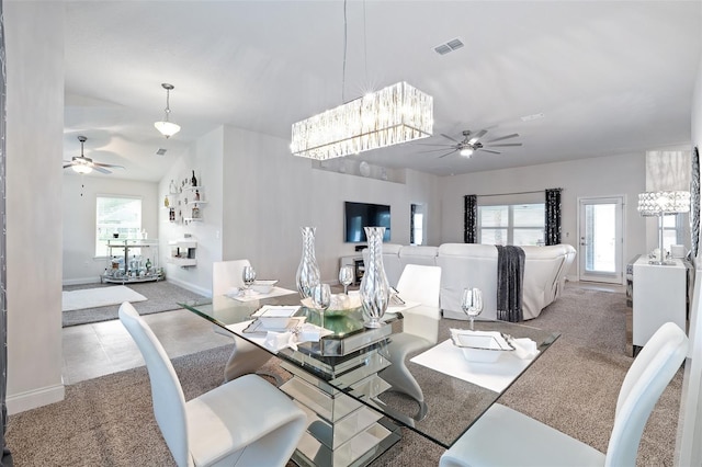 28 Noah Blvd, Flagler Beach, FL 32136 - carpeted dining space featuring a ceiling fan and a chandelier