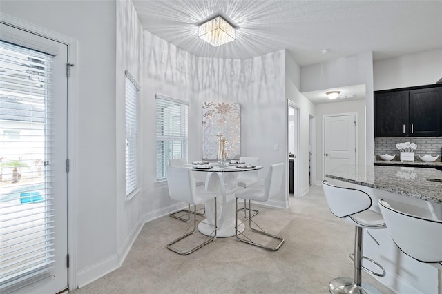 28 Noah Blvd, Flagler Beach, FL 32136 - dining room with baseboards and a chandelier