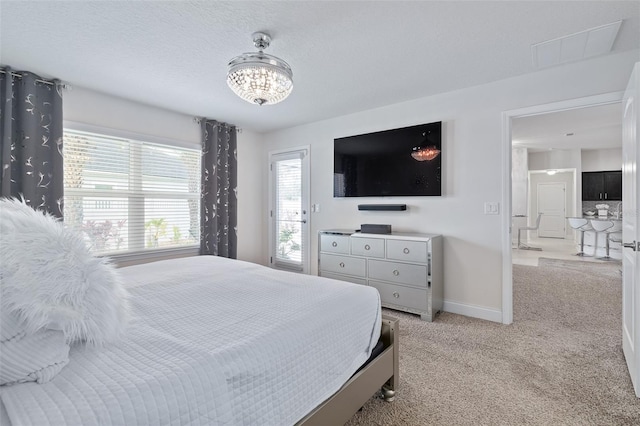 28 Noah Blvd, Flagler Beach, FL 32136 - bedroom featuring light carpet and a chandelier