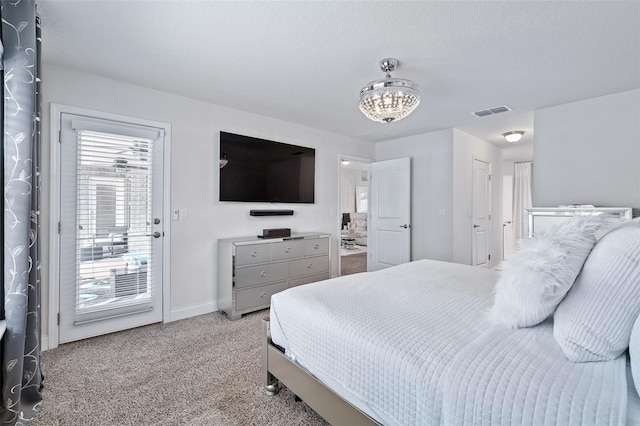 28 Noah Blvd, Flagler Beach, FL 32136 - bedroom featuring access to outside, light colored carpet, and a chandelier