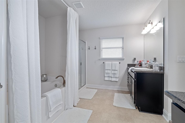 28 Noah Blvd, Flagler Beach, FL 32136 - full bathroom featuring vanity, a garden tub, curtained shower, and a textured ceiling