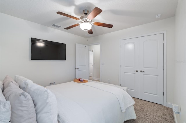 28 Noah Blvd, Flagler Beach, FL 32136 - bedroom featuring a closet, a ceiling fan, and light colored carpet