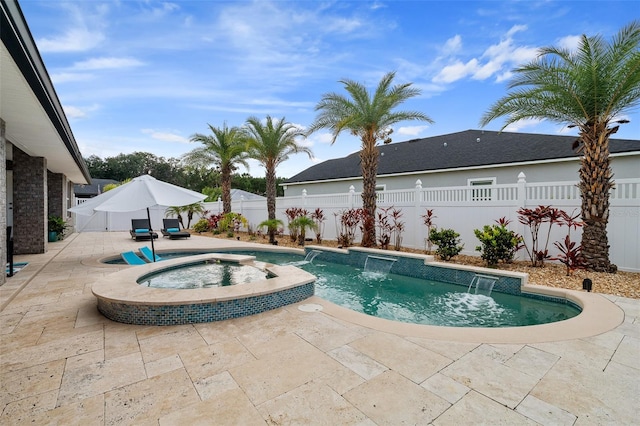 28 Noah Blvd, Flagler Beach, FL 32136 - view of pool with a patio area, a fenced backyard, and a pool with connected hot tub