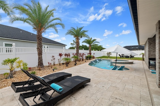 28 Noah Blvd, Flagler Beach, FL 32136 - view of pool with a patio, a fenced backyard, and a pool with connected hot tub