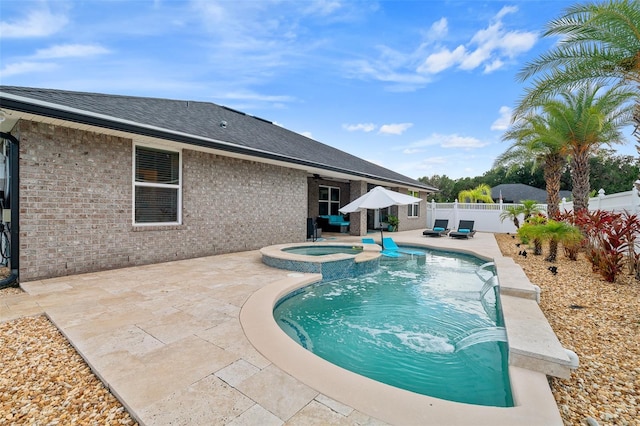 28 Noah Blvd, Flagler Beach, FL 32136 - view of pool featuring a patio, a fenced backyard, and a pool with connected hot tub