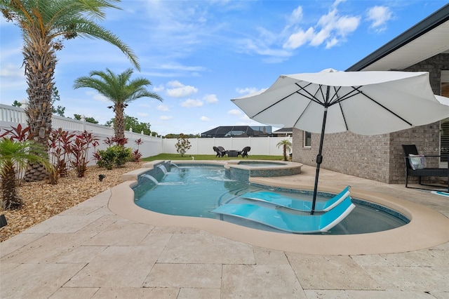 28 Noah Blvd, Flagler Beach, FL 32136 - view of swimming pool with a fenced backyard, a patio area, and a pool with connected hot tub