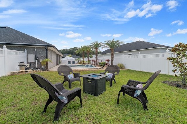 28 Noah Blvd, Flagler Beach, FL 32136 - fenced backyard with an outdoor fire pit