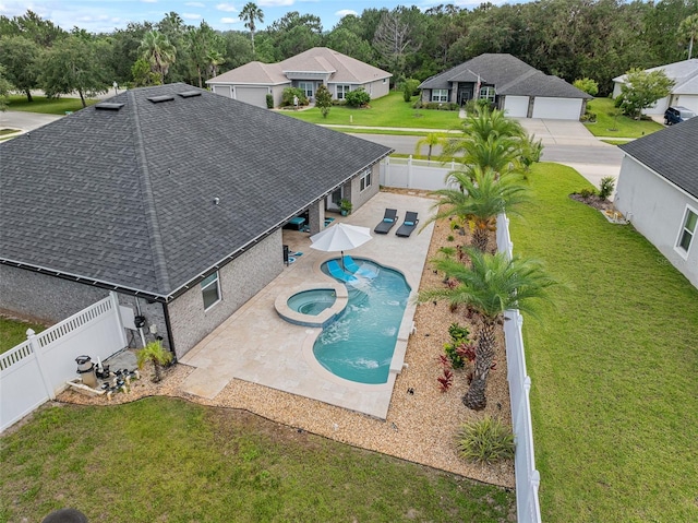 28 Noah Blvd, Flagler Beach, FL 32136 - view of pool with a fenced backyard, a pool with connected hot tub, a patio, and a residential view