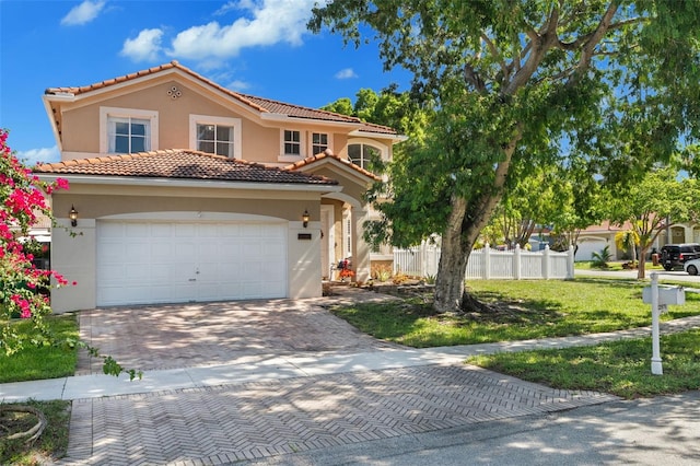 12978 SW 26th St, Miramar, FL 33027 - mediterranean / spanish home with stucco siding, decorative driveway, and a tile roof
