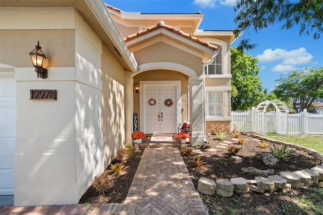 12978 SW 26th St, Miramar, FL 33027 - view of exterior entry featuring stucco siding