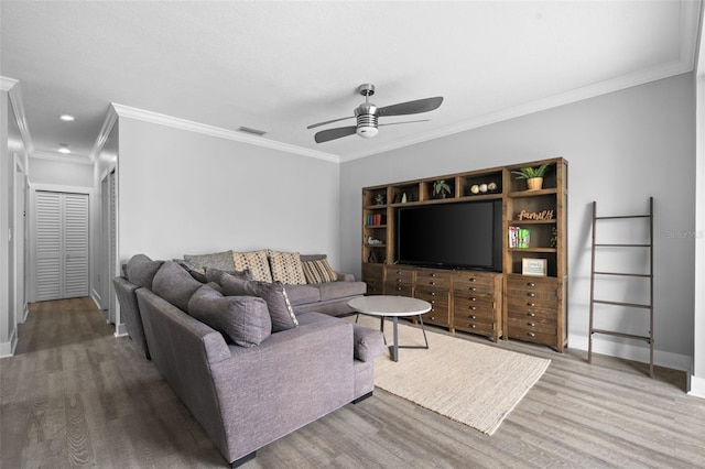 12978 SW 26th St, Miramar, FL 33027 - living area with wood finished floors, a ceiling fan, crown molding, and recessed lighting