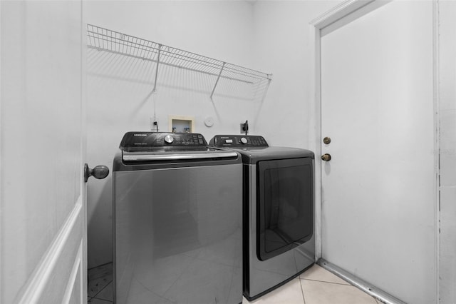 12978 SW 26th St, Miramar, FL 33027 - laundry area featuring washer and clothes dryer and light tile patterned floors