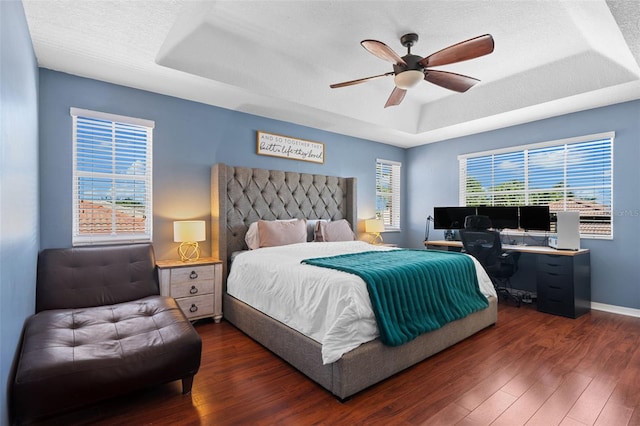 12978 SW 26th St, Miramar, FL 33027 - bedroom with a raised ceiling, wood finished floors, a ceiling fan, an office area, and a textured ceiling