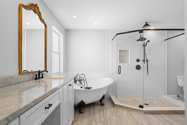 12978 SW 26th St, Miramar, FL 33027 - bathroom with a soaking tub, a shower stall, vanity, recessed lighting, and wood finished floors