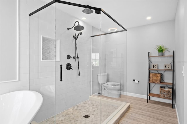 12978 SW 26th St, Miramar, FL 33027 - bathroom featuring a stall shower, a soaking tub, wood finished floors, and recessed lighting