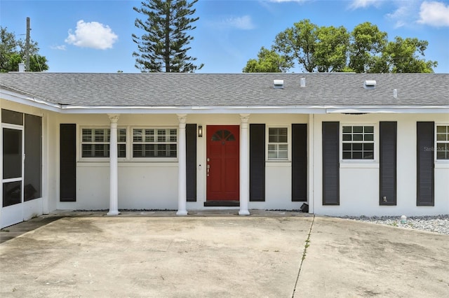 4611 Cranston Pl, Orlando, FL 32812 - view of front of property featuring a shingled roof and covered porch