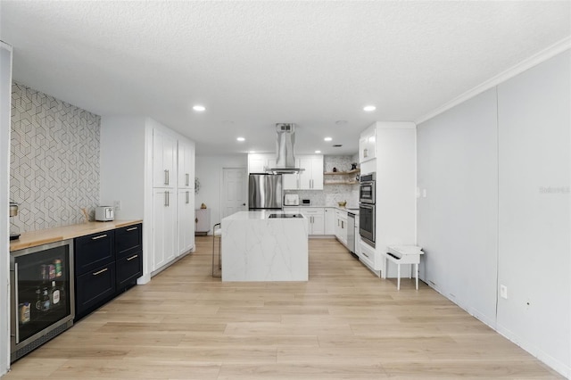 4611 Cranston Pl, Orlando, FL 32812 - kitchen featuring stainless steel appliances, beverage cooler, decorative backsplash, open shelves, and light wood-type flooring