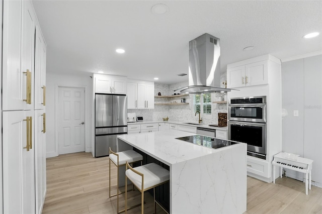 4611 Cranston Pl, Orlando, FL 32812 - kitchen featuring stainless steel appliances, open shelves, island range hood, white cabinetry, and recessed lighting