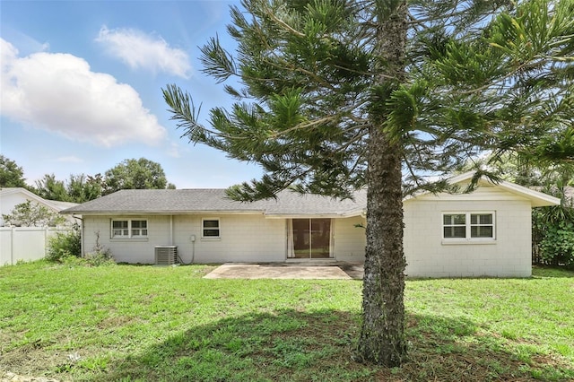 4611 Cranston Pl, Orlando, FL 32812 - rear view of house with concrete block siding and a patio area