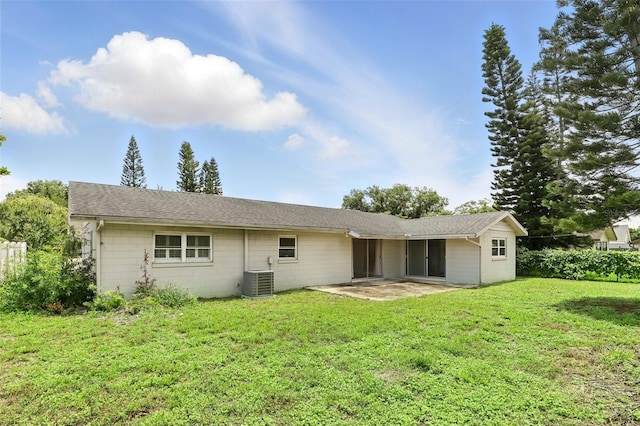 4611 Cranston Pl, Orlando, FL 32812 - back of house with a patio area, a lawn, concrete block siding, and a shingled roof