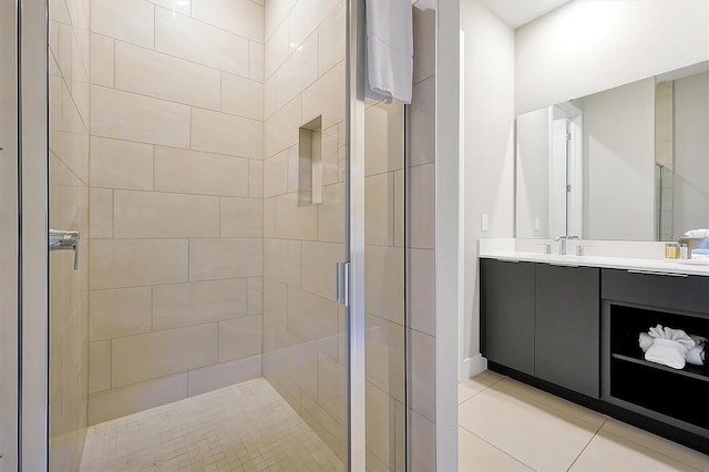 7770 Sandy Ridge Dr Unit 117, Reunion, FL 34747 - bathroom featuring a shower stall, vanity, and tile patterned floors