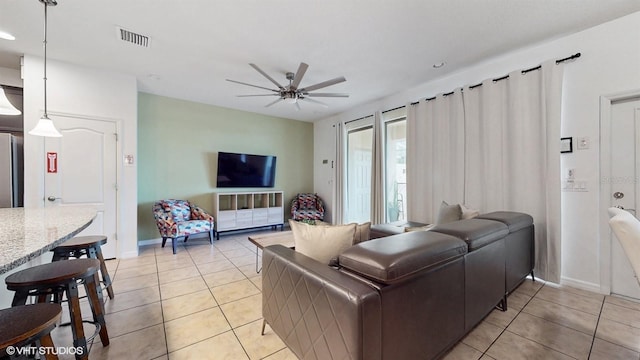 8806 Geneve Ct, Kissimmee, FL 34747 - living area featuring light tile patterned floors, ceiling fan, and recessed lighting