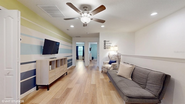 8806 Geneve Ct, Kissimmee, FL 34747 - living area with light wood finished floors, ceiling fan, and recessed lighting