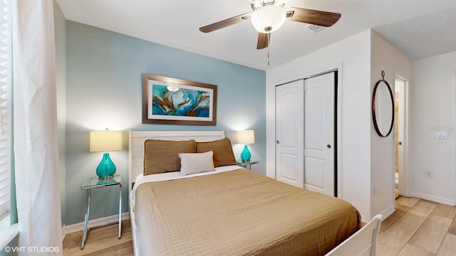 8806 Geneve Ct, Kissimmee, FL 34747 - bedroom with a closet, ceiling fan, and light wood-type flooring